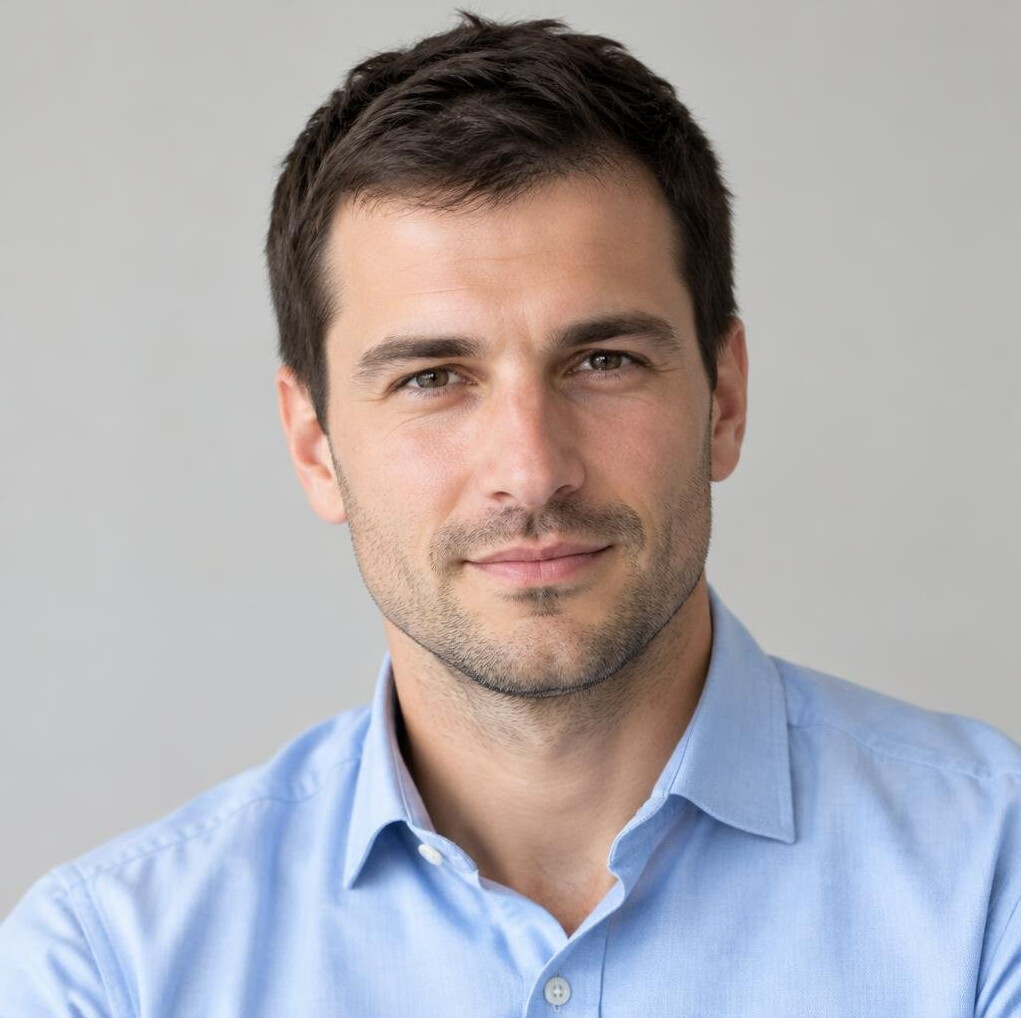 Portrait of a young man with short hair wearing a shirt
